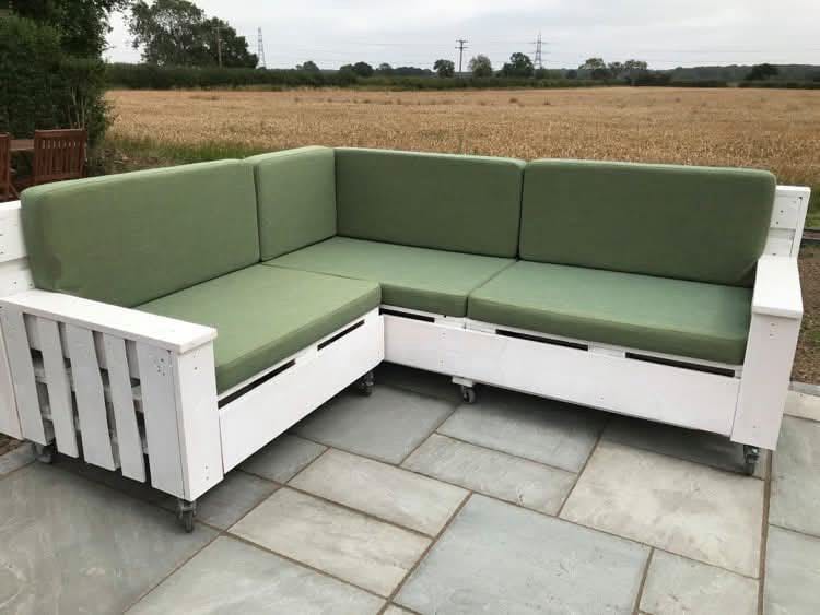 Image of outdoor furniture with green cushions