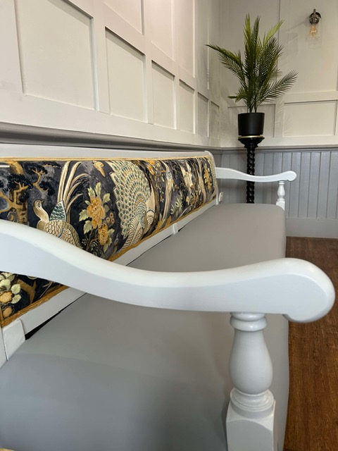 A side view of a luxurious reupholstered bench