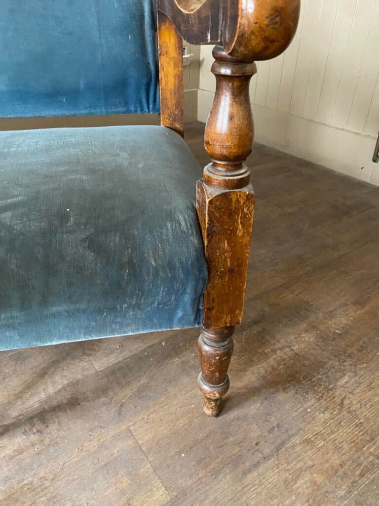 An image of a leg on a run down old bench