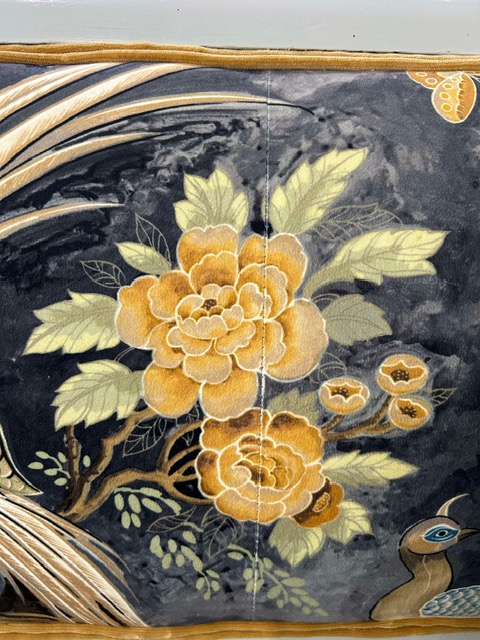 A close up of a floral pattern on a luxury, revitalised bench