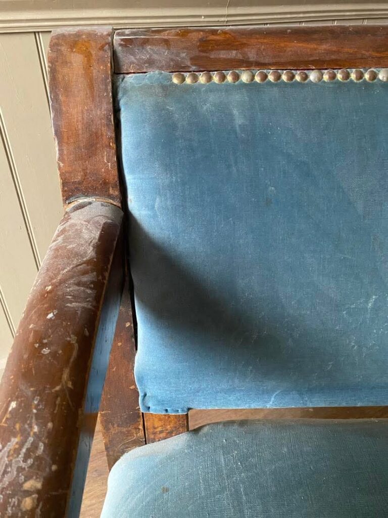 An image of an arm on an old bench